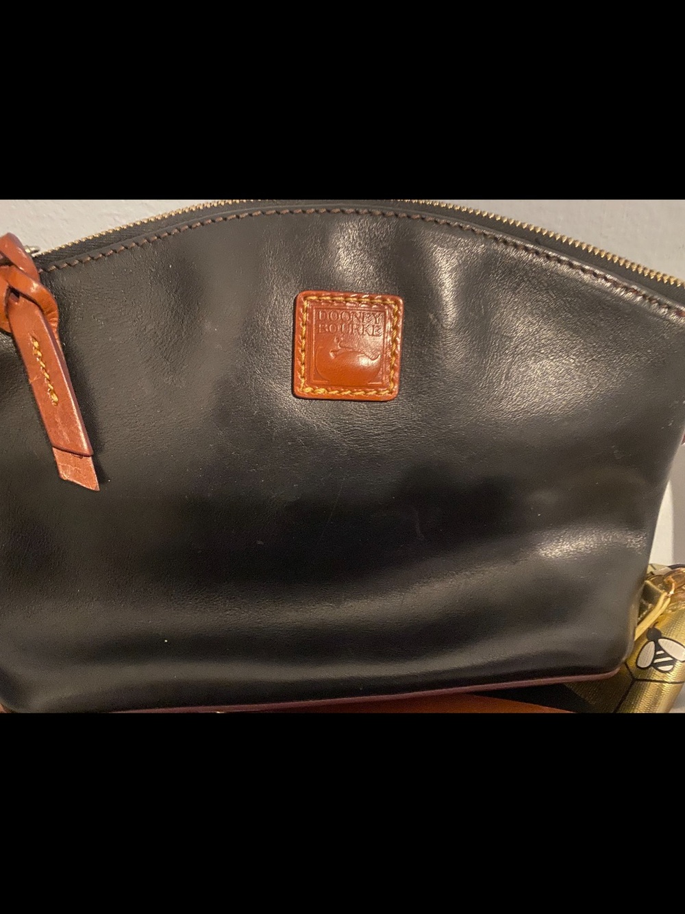 Great condition Dooney & Bourke Black Leather Toiletry Pouch with Brown Trim